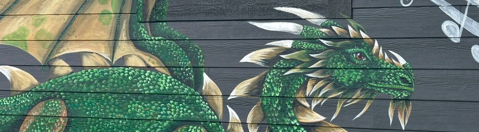 Close up of the green dragon mural painted on the AMP building